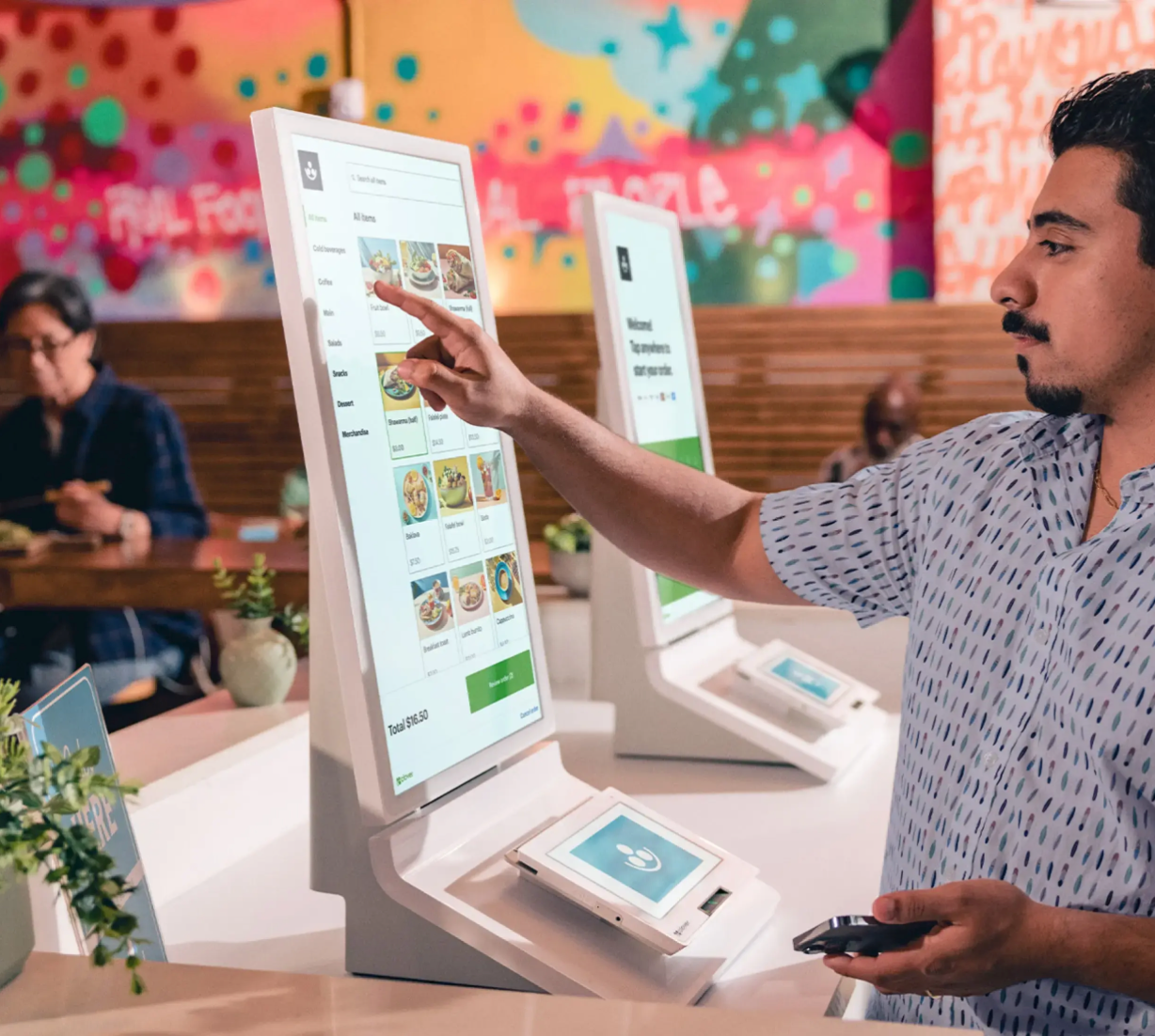 Customer using Clover kiosk